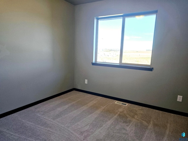 empty room featuring carpet flooring