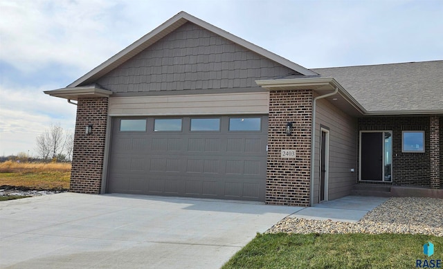 view of side of property featuring a garage