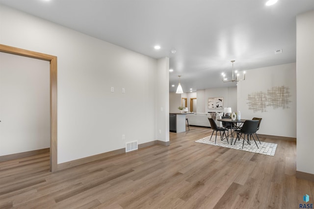 7309 E Shadow Pine Cir, Sioux Falls, SD 57110 - dining space featuring a chandelier, recessed lighting, light wood-type flooring, and baseboards