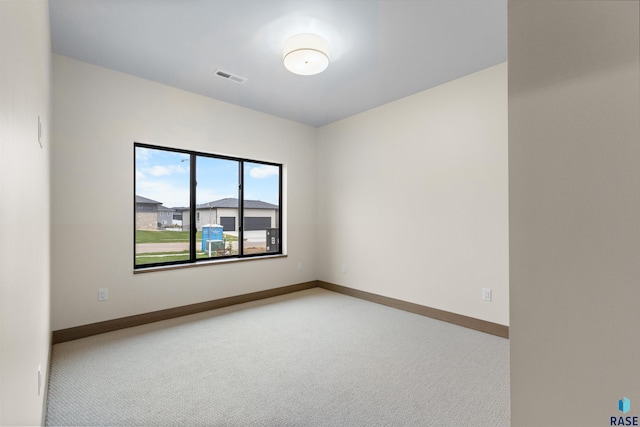 7309 E Shadow Pine Cir, Sioux Falls, SD 57110 - spare room featuring carpet flooring and baseboards