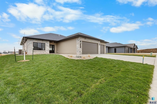 7309 E Shadow Pine Cir, Sioux Falls, SD 57110 - prairie-style house with a garage, a front yard, driveway, cooling unit, and stone siding