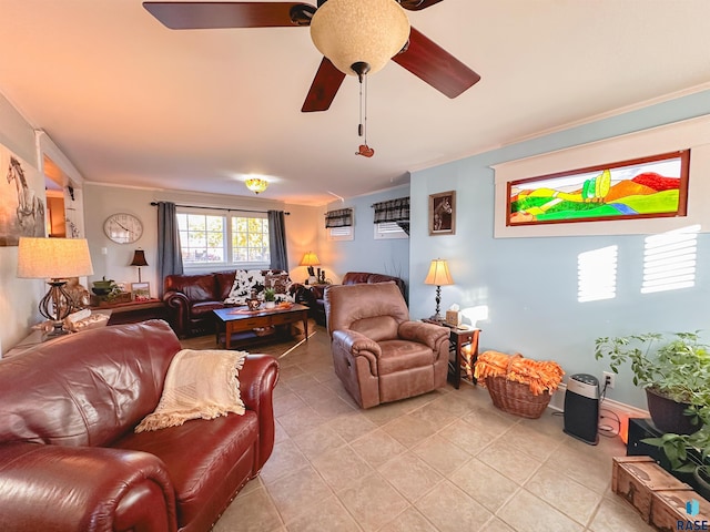 living room with light tile patterned floors, ceiling fan, and crown molding