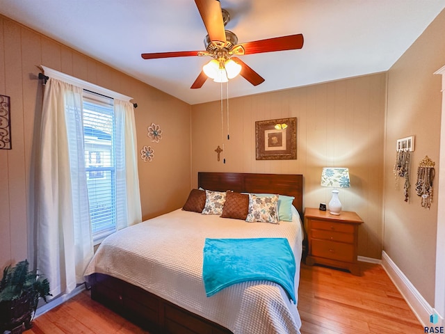 bedroom featuring light wood-type flooring and ceiling fan