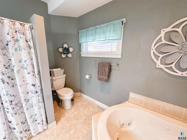 bathroom with toilet, a tub, and tile patterned floors