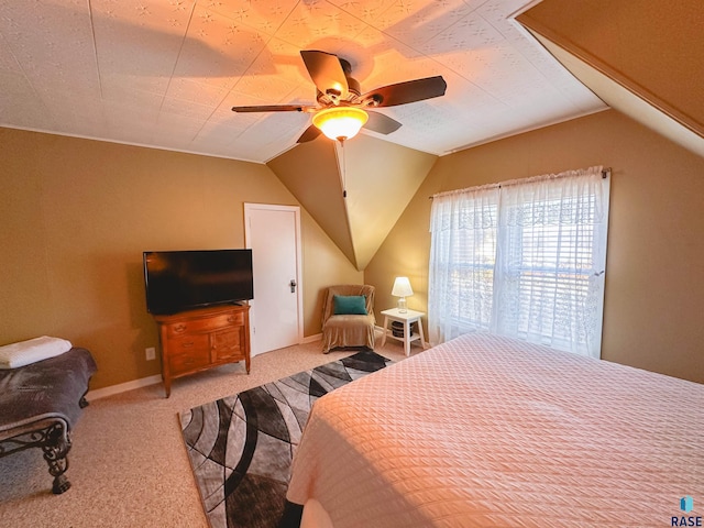 bedroom with ceiling fan, light colored carpet, and lofted ceiling