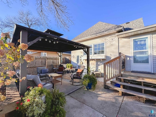 view of patio / terrace with a wooden deck, outdoor lounge area, and a gazebo