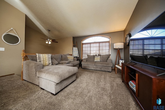 living room featuring lofted ceiling, a textured ceiling, carpet, and ceiling fan