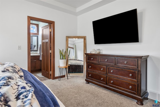 carpeted bedroom with ensuite bath