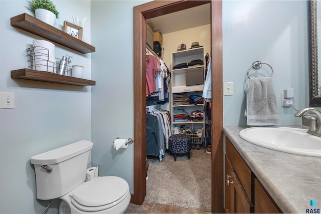 bathroom with vanity and toilet