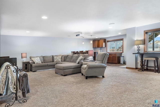 living room with plenty of natural light and light colored carpet