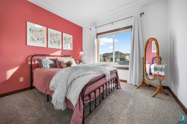 carpeted bedroom with ornamental molding