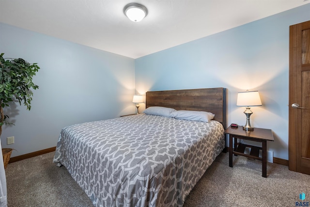 bedroom with dark carpet