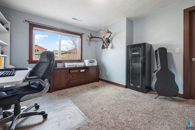 home office featuring a textured ceiling and light carpet