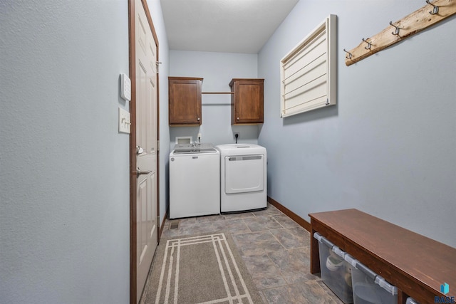 washroom with cabinets and independent washer and dryer