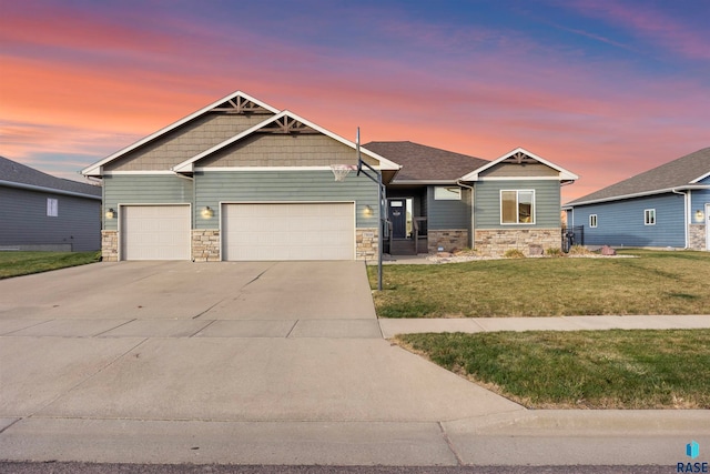 craftsman-style home with a lawn and a garage