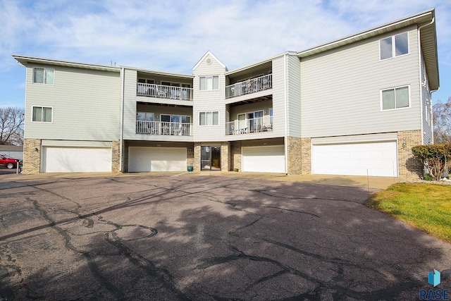 exterior space with a balcony and a garage