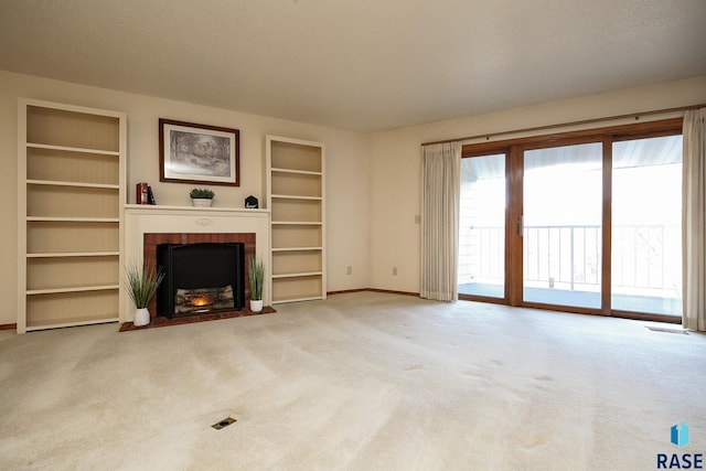 unfurnished living room with a brick fireplace and light carpet