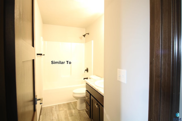 1249 N Marion Rd Unit 2, Sioux Falls, SD 57107 - bathroom with toilet, wood finished floors, vanity, and shower / bath combination