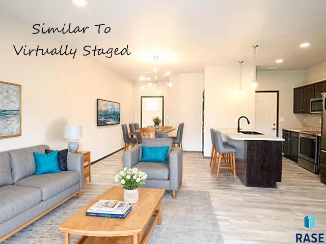 1249 N Marion Rd Unit 2, Sioux Falls, SD 57107 - living area featuring light wood finished floors, a chandelier, and recessed lighting
