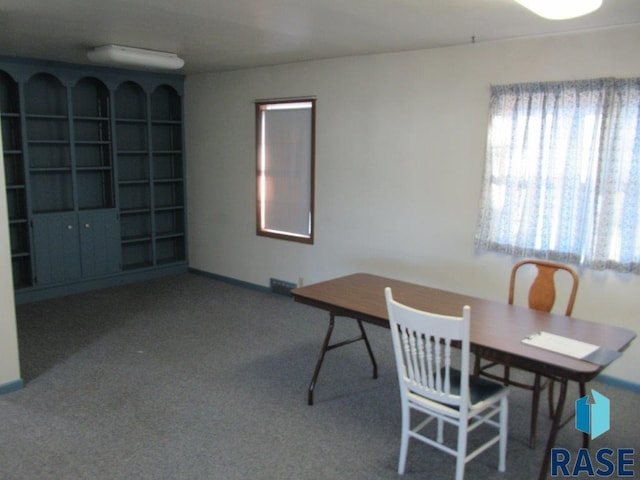 dining room featuring carpet flooring