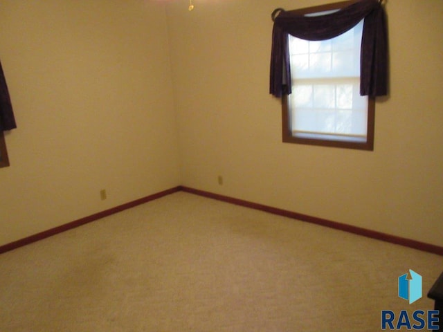 unfurnished room featuring carpet floors