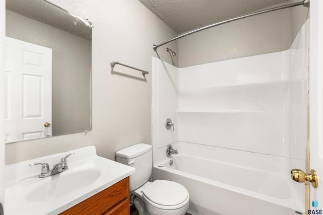 full bathroom featuring vanity, a textured ceiling, toilet, and tub / shower combination