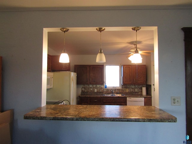 kitchen featuring sink, ceiling fan, decorative light fixtures, white appliances, and decorative backsplash