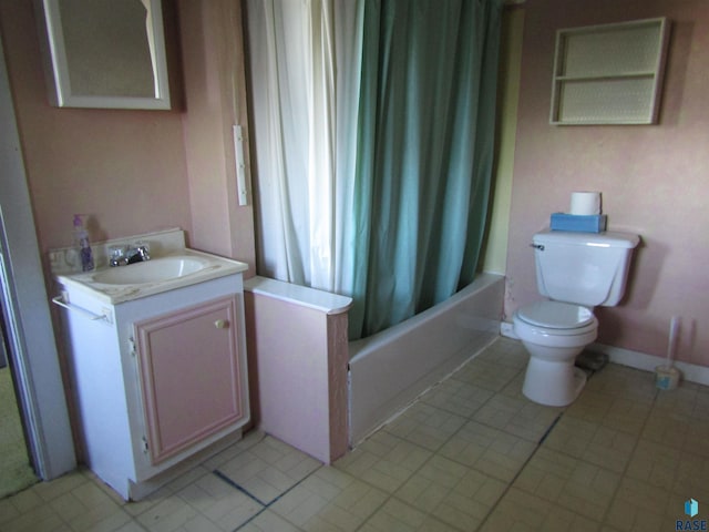 full bathroom featuring tile patterned floors, vanity, toilet, and shower / tub combo