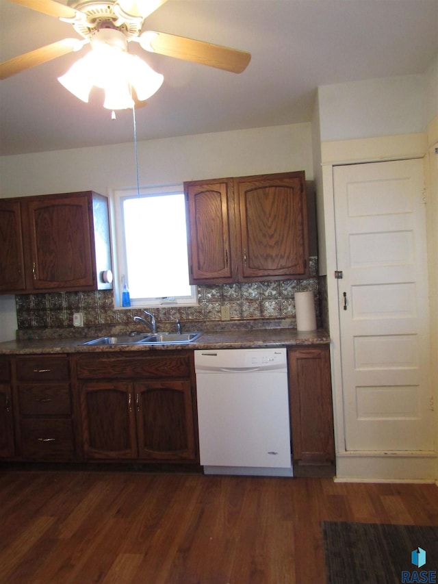 kitchen with sink, tasteful backsplash, white dishwasher, ceiling fan, and dark hardwood / wood-style flooring