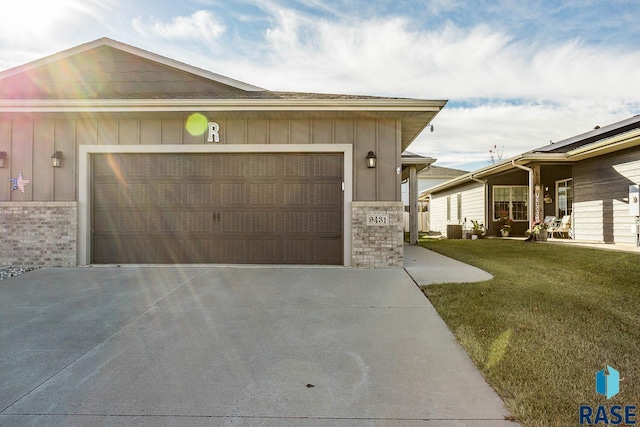 view of front of home with a garage and a front yard