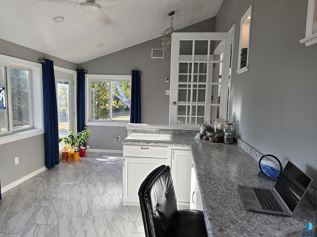 kitchen featuring white cabinets, wooden ceiling, ceiling fan, and lofted ceiling