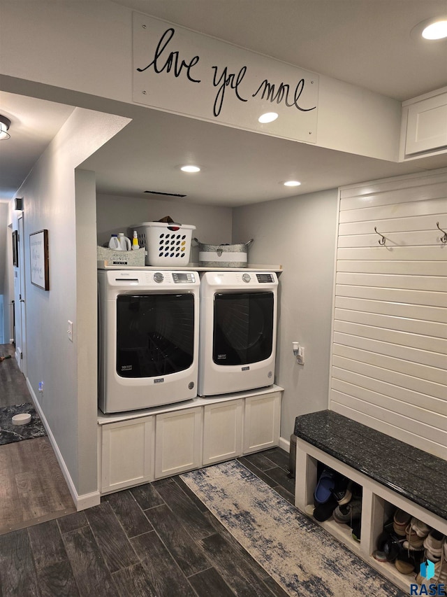 laundry room with dark wood-type flooring and washer and clothes dryer