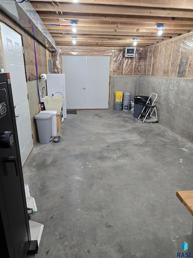 basement with white refrigerator