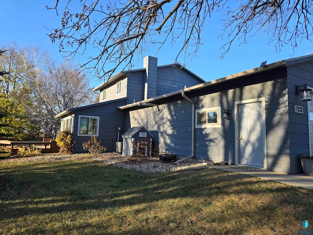 view of side of home featuring a yard