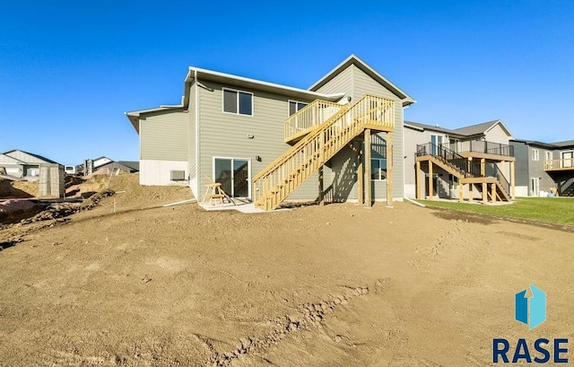 rear view of property with a deck