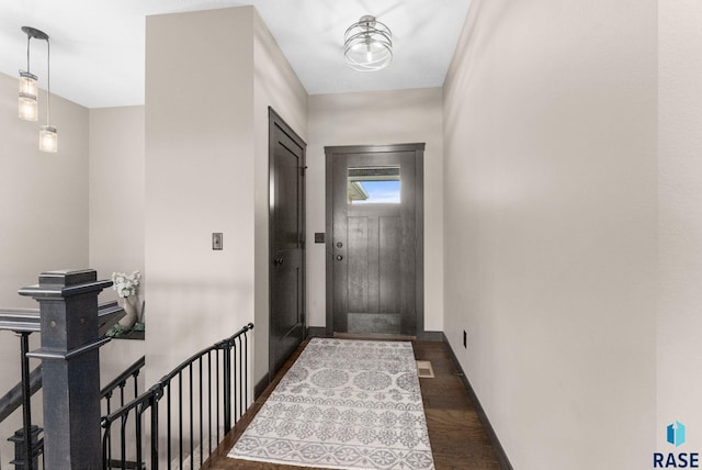 doorway with dark hardwood / wood-style floors