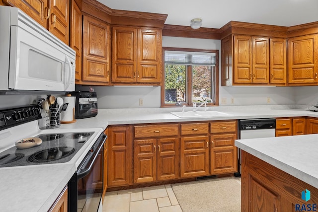 kitchen with sink and white appliances