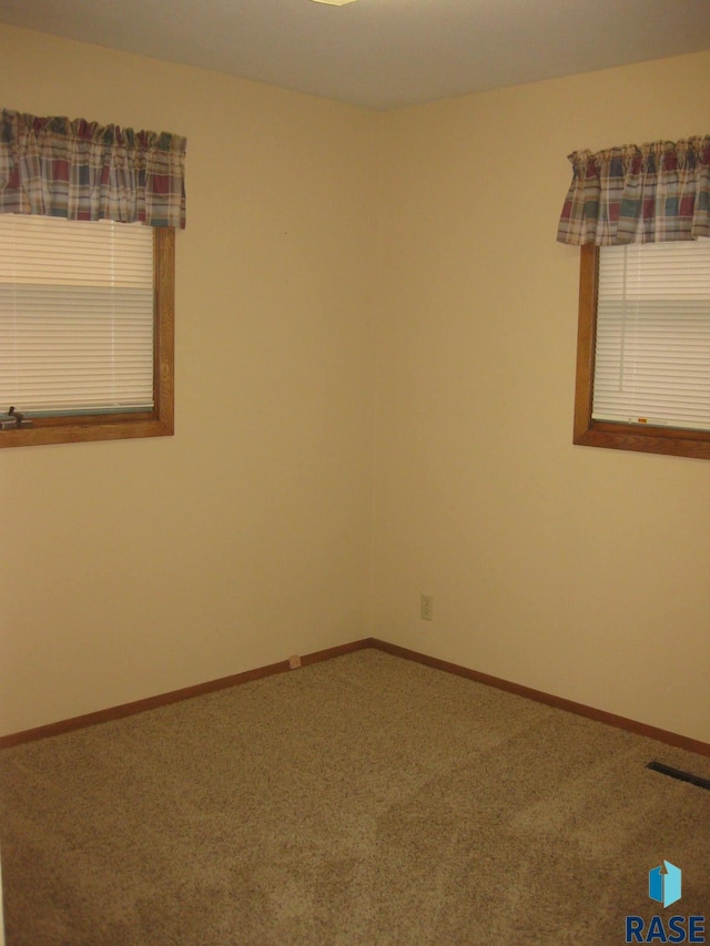 empty room featuring carpet flooring