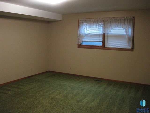 spare room featuring carpet floors