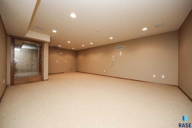 basement with light colored carpet