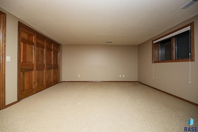 unfurnished bedroom featuring a closet and carpet flooring