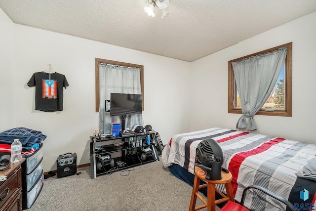 carpeted bedroom featuring a textured ceiling