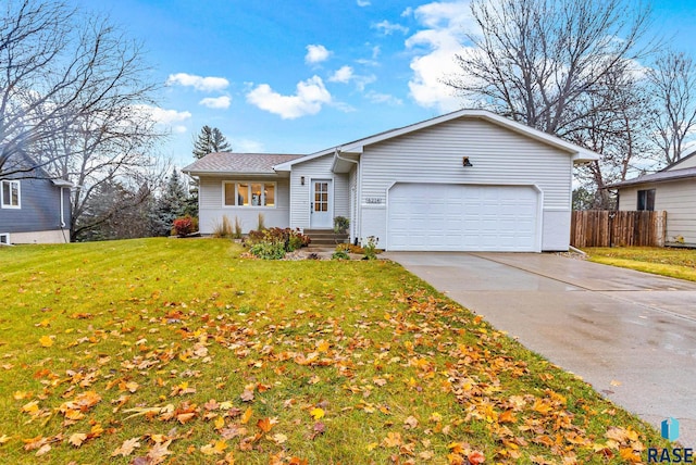 ranch-style home featuring a front lawn and a garage