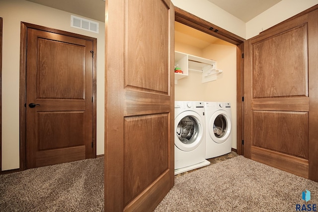 laundry room featuring dark colored carpet and independent washer and dryer