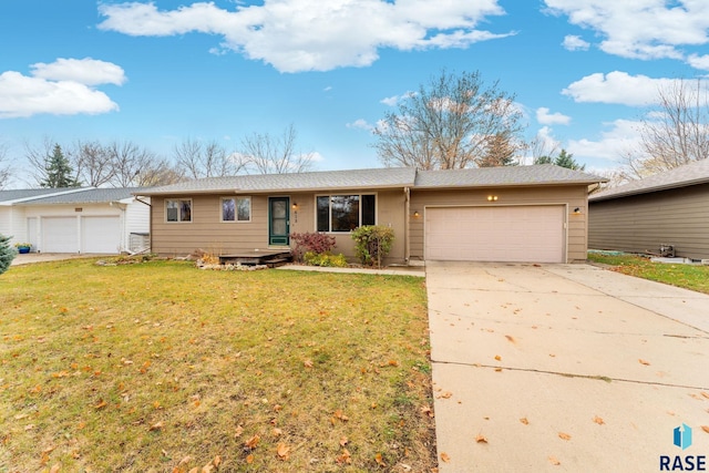 ranch-style home with a front lawn and a garage