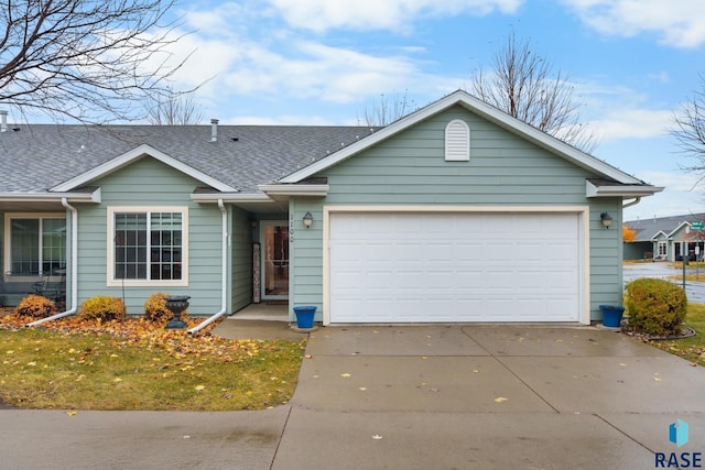 ranch-style home featuring a garage