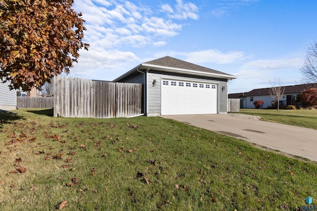 view of property exterior featuring a garage and a lawn