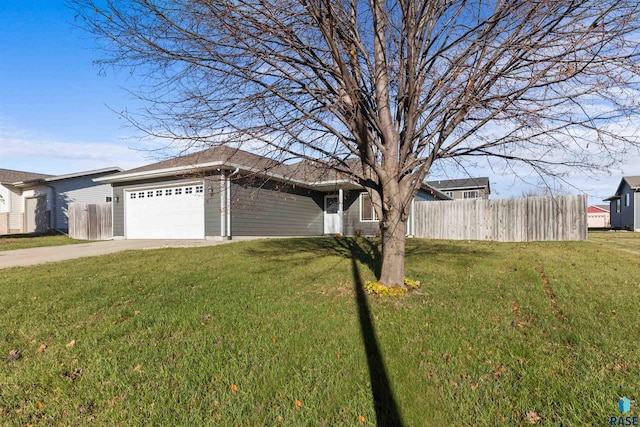 view of front of home featuring a front lawn and a garage