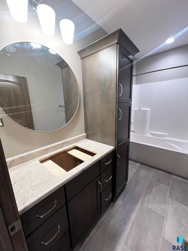 bathroom with shower / bath combination and vanity