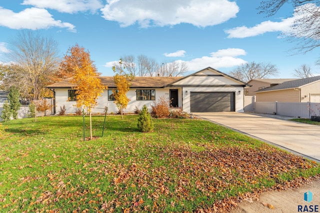 ranch-style house featuring a garage and a front lawn